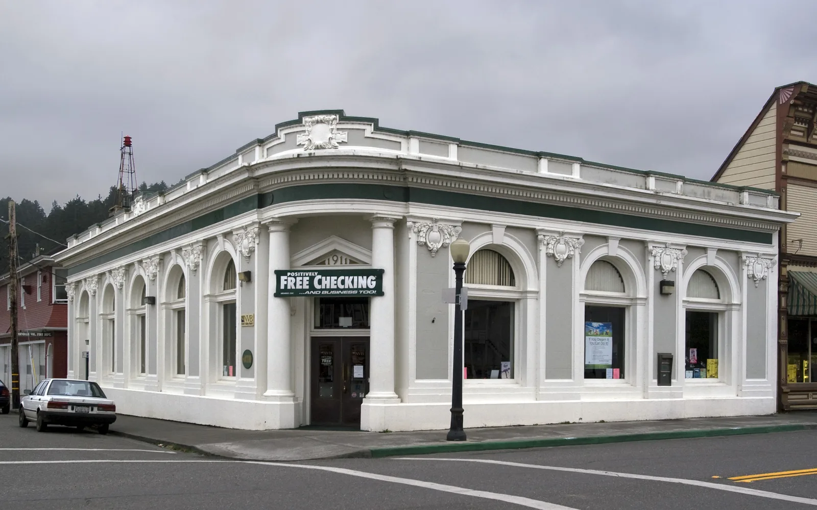 A historic Victorian bank building in Ferndale, California, with detailed architectural stonework and period features